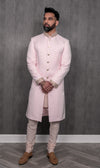 Front-facing view of PARAM light pink sherwani jacket with pearl cuffs and collar in front of simple gray background