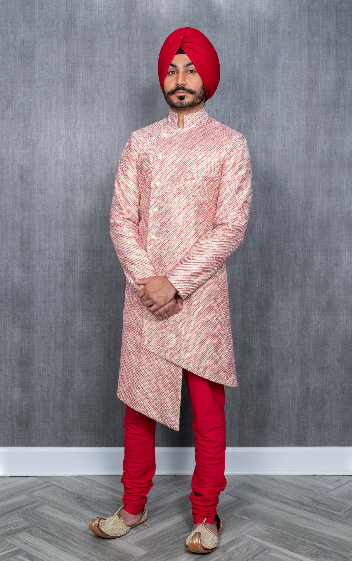 Red and gold striped groom sherwani with red pajama pant and red turban