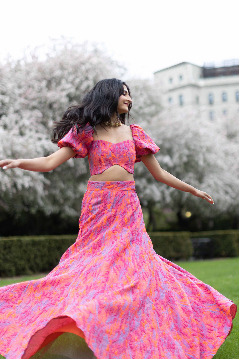 Diya Sharma twirling in the orange and pink tyra lehenga skirt - Harleen Kaur