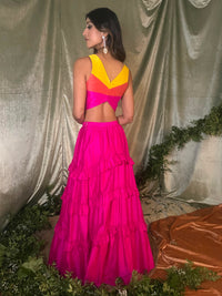 Anavi Sharma in a silk yellow, orange, and pink colorblock lehenga top - Back View - Harleen Kaur